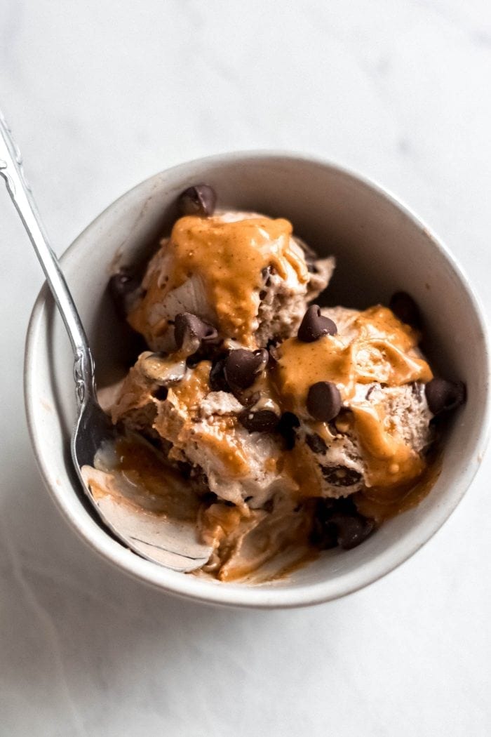 Bowl with 3 scoops of vegan peanut butter chocolate chip banana ice cream.
