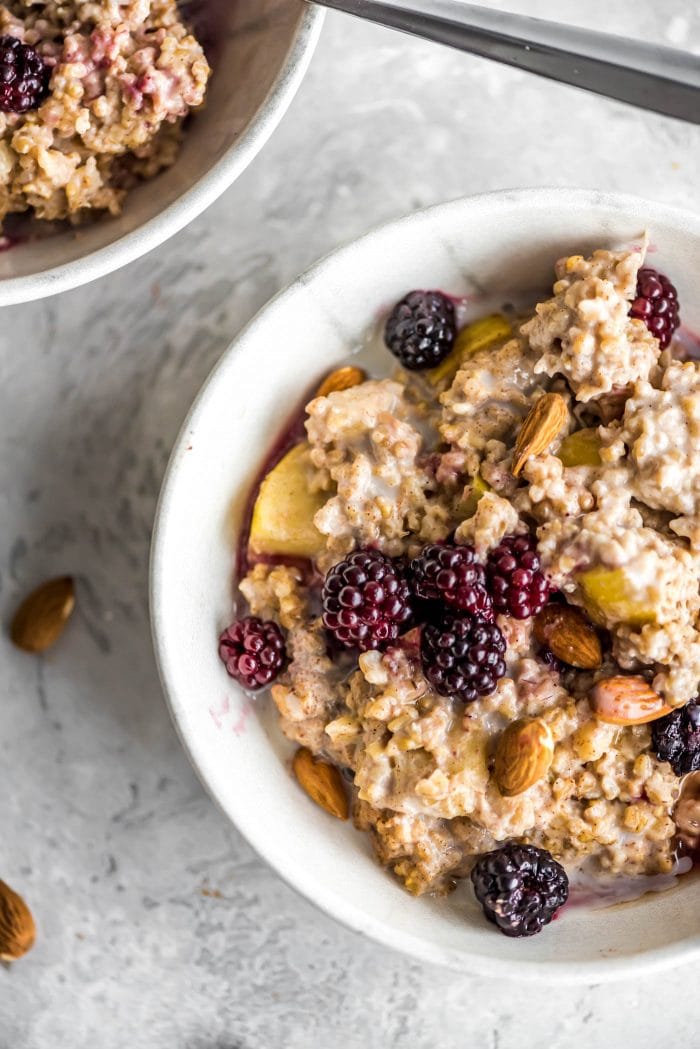 Oven baked steel cut oatmeal with apples and banana, topped with berries and almonds.
