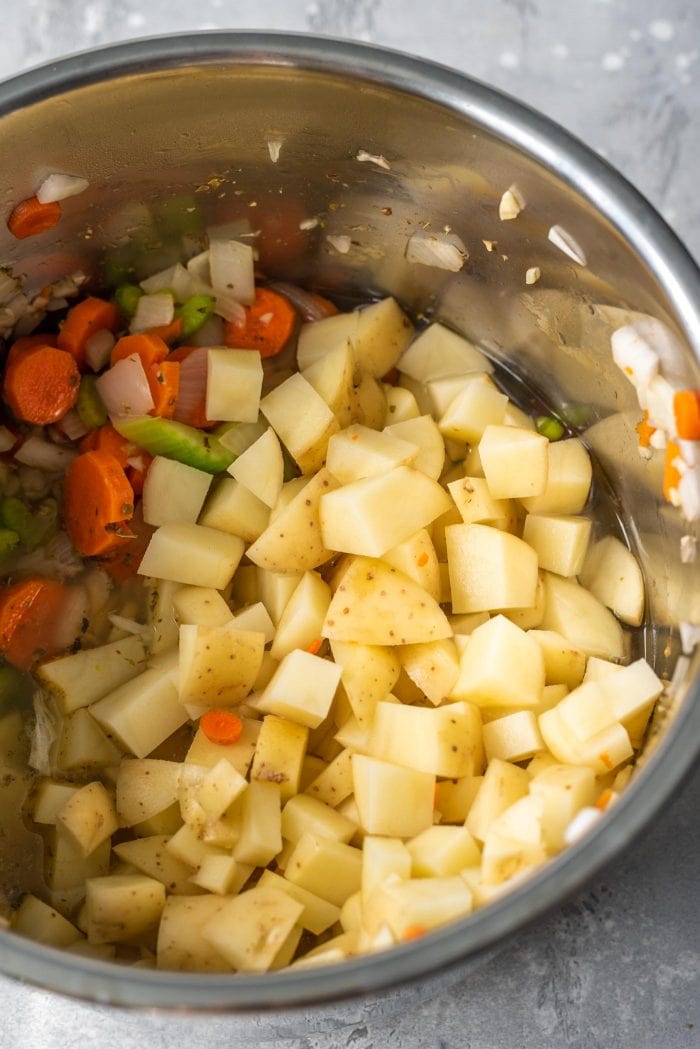 Potatoes, carrots, celery and onion in an Instant Pot.