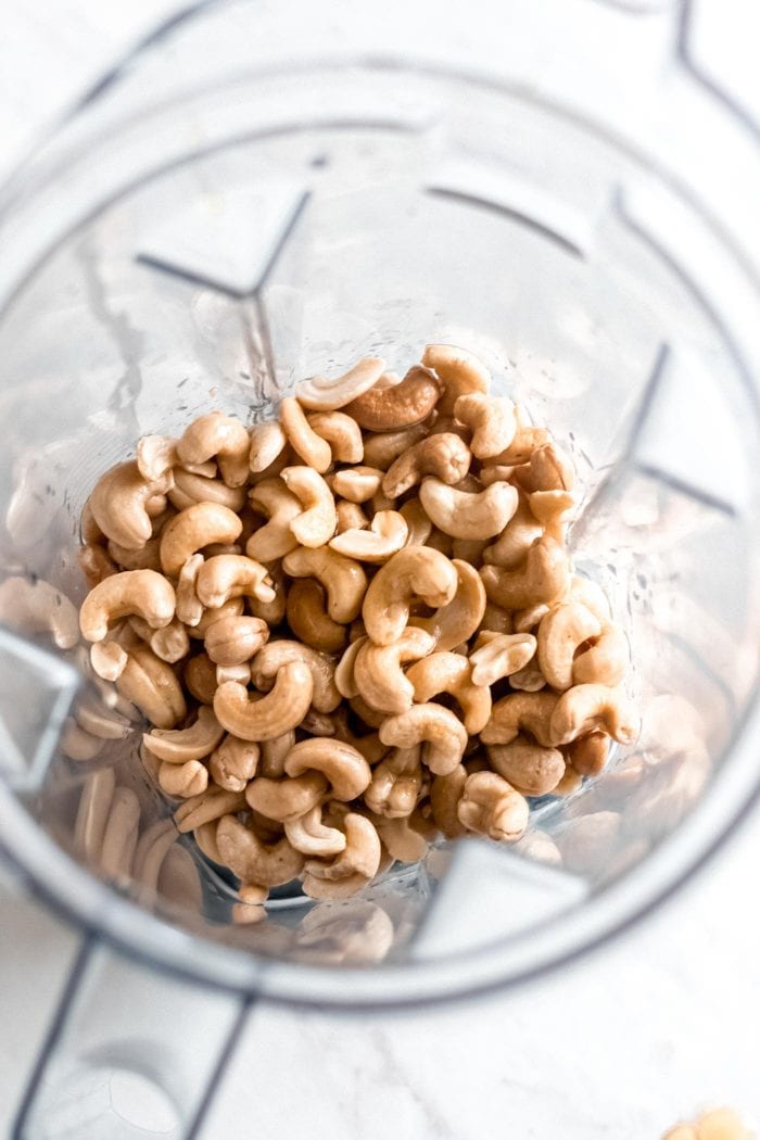 Soaked raw cashews in a blender to make cashew cream cheese frosting.