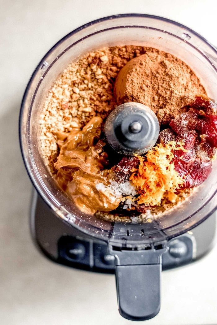 Almond butter, orange zest, dates and cocoa powder in a food processor with almond flour.