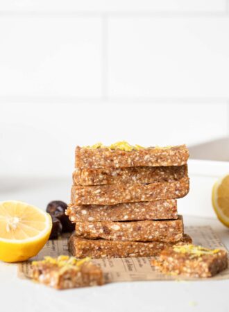 A stack of lemon energy bars on a kitchen counter.