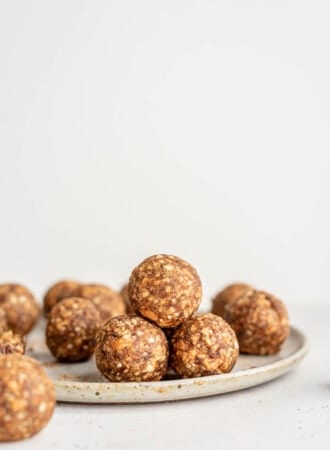 A stack of energy balls on a plate.
