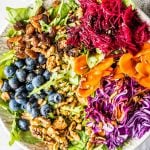 Salad with beet, carrot, walnuts, raisins, cabbage and blueberries.