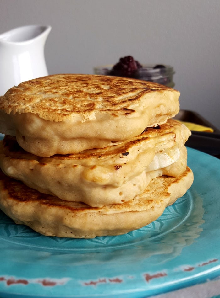Stack of 3 thick protein pancakes on a plate.