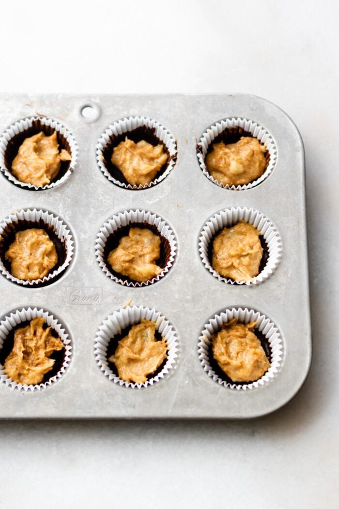 Mini muffin liners filled with chocolate and and peanut butter banana filling.