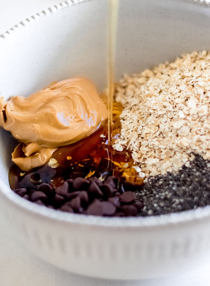 Chocolate chips, oats, maple syrup and peanut butter in a large mixing bowl.