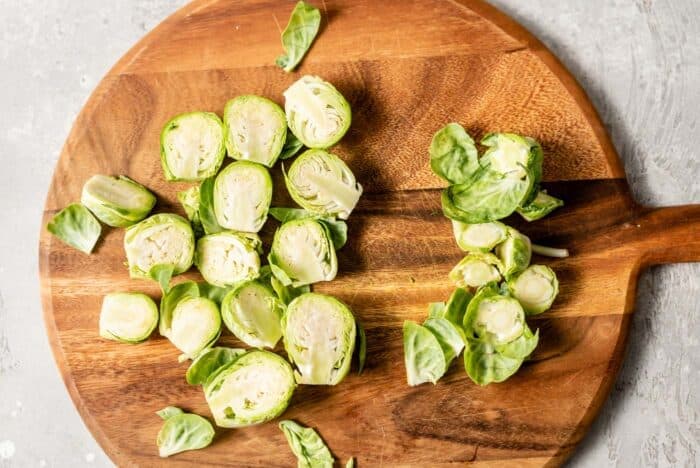 Chopped brussels sprouts on a cutting board.