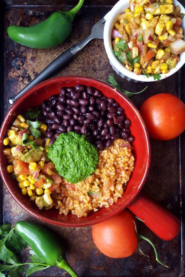 Vegan Burrito Bowls with Chimmichurri Sauce and Avocado Corn Salsa