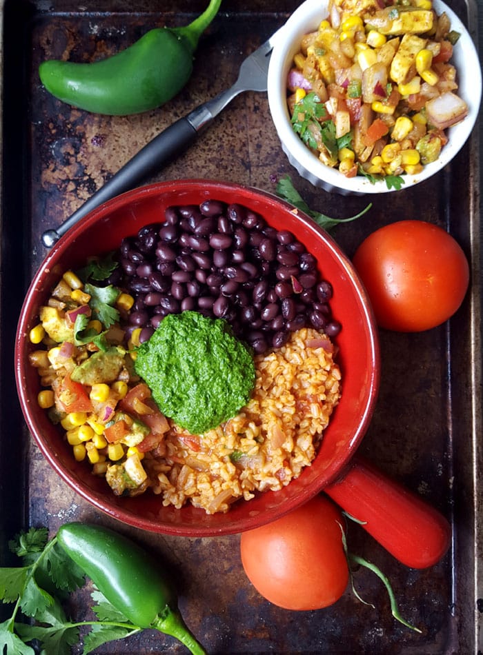 Vegan Burrito Bowls with Chimmichurri Sauce and Avocado Corn Salsa