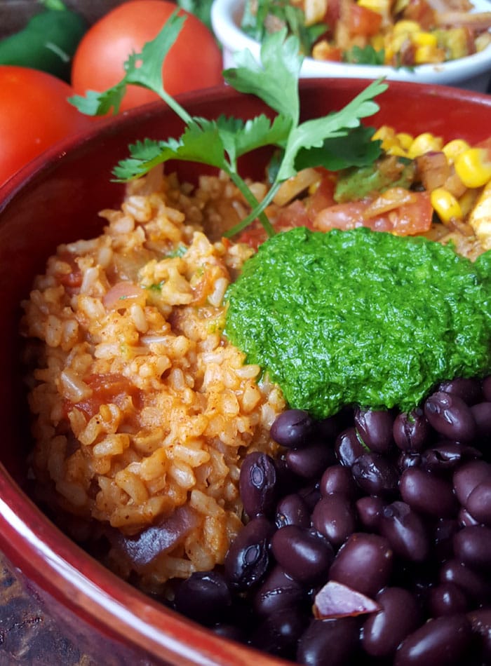 Vegan Burrito Bowls with Chimmichurri Sauce and Avocado Corn Salsa