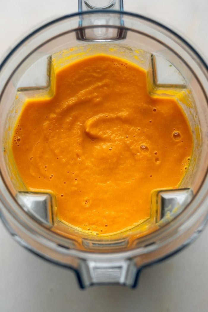 Creamy carrot soup in a blender.