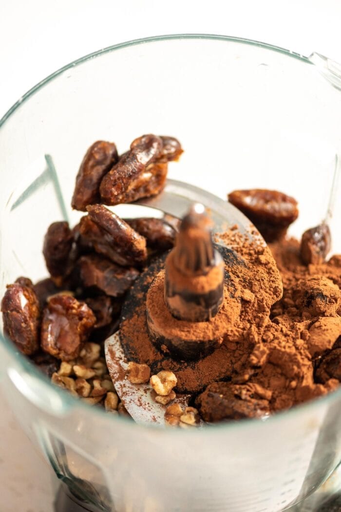 Dates, cocoa powder and walnuts in a food processor.