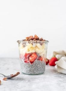 Vanilla chia seed pudding topped with fresh fruit and pecans.