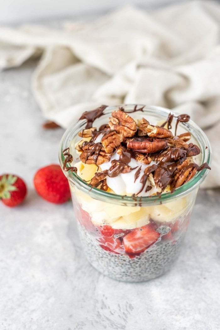 Chia seed pudding topped with banana, pineapple, strawberries and pecans.