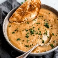 Easy vegan roasted garlic cauliflower soup with fresh bread.