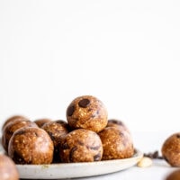 A plate full of chocolate chip cookie dough balls.