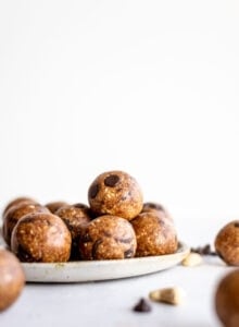 A plate full of chocolate chip cookie dough balls.