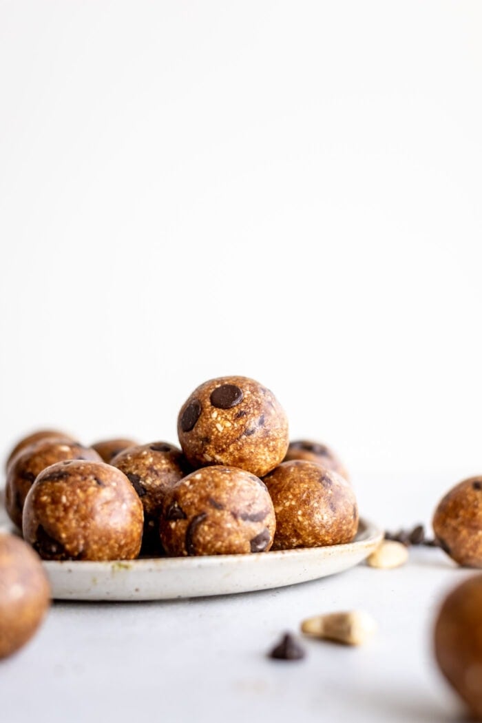 A plate full of chocolate chip cookie dough balls.