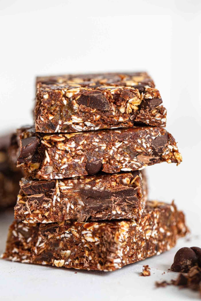 A stack of chocolate bars with chocolate chunks in them.