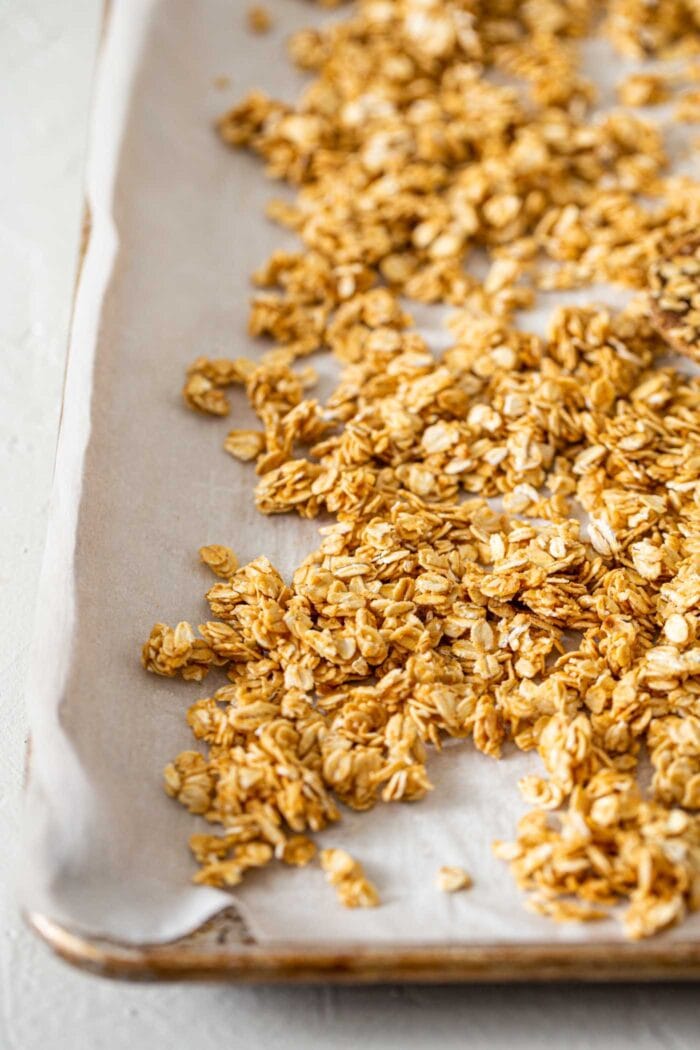 A close up of peanut butter granola on a baking tray.