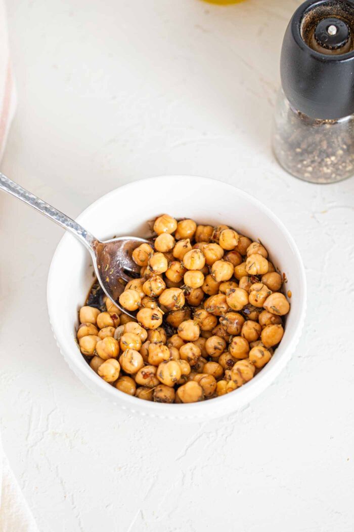 Marinated chickpeas in a small dish.