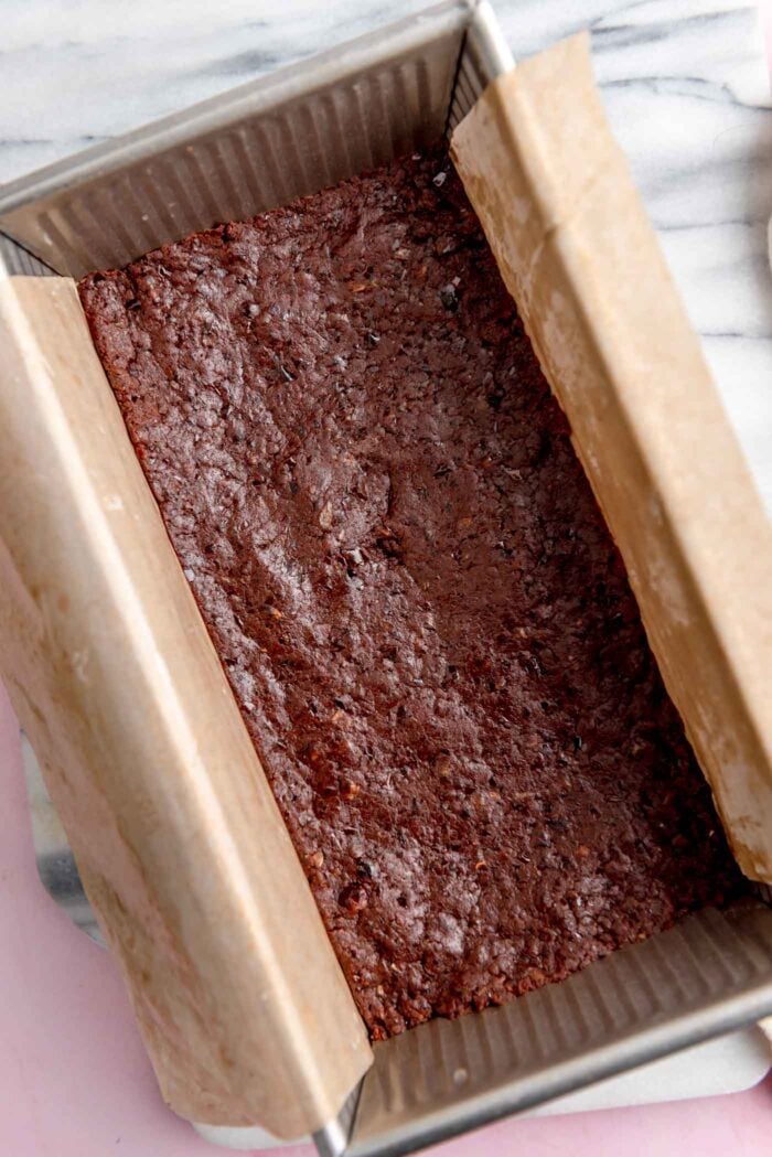 Chocolate bars in a lined loaf pan.