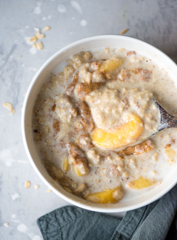 Vegan Peaches and Cream Oatmeal with Almond Butter and Flax Seeds