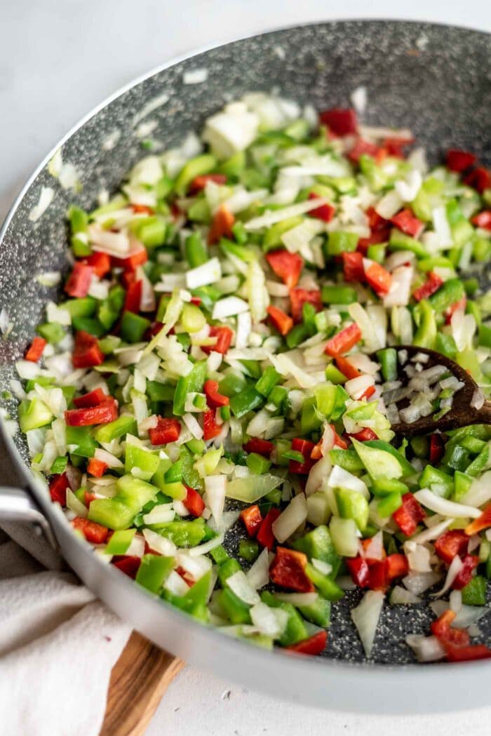 Diced bell peppers, onions and garlic in a large skillet.