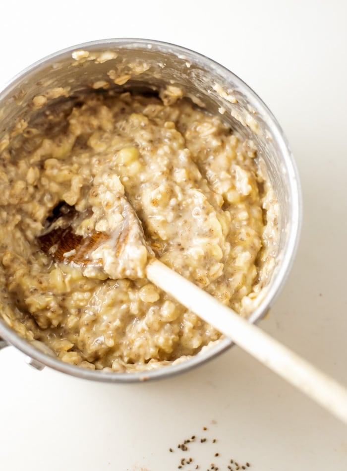 Overhead image of a pot of cooked oats with banana.