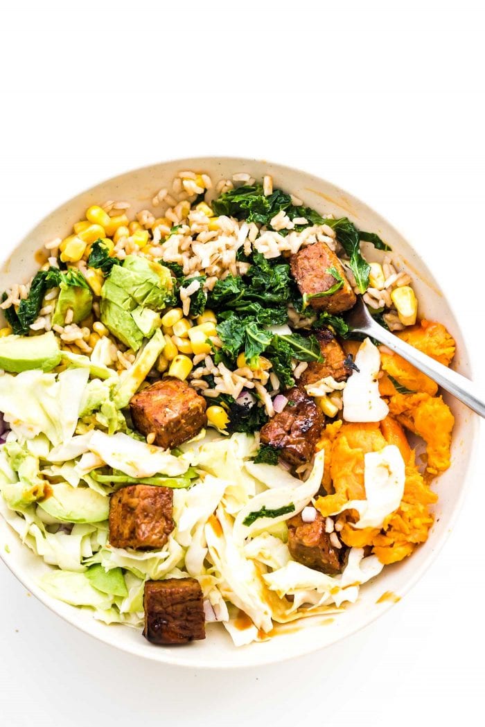 BBQ tempeh, kale, brown rice, sweet potato and corn in a BBQ Tempeh bowl.