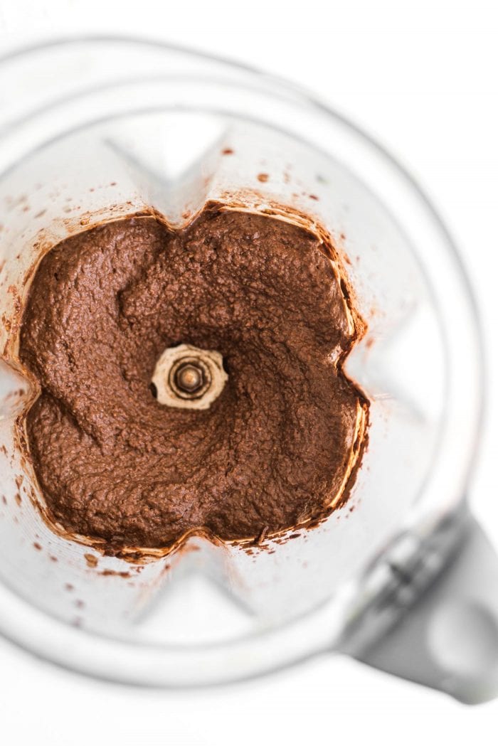 Blended chocolate chickpea dip in a blender.