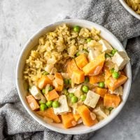 Small bowl of sweet potato curry with brown rice.