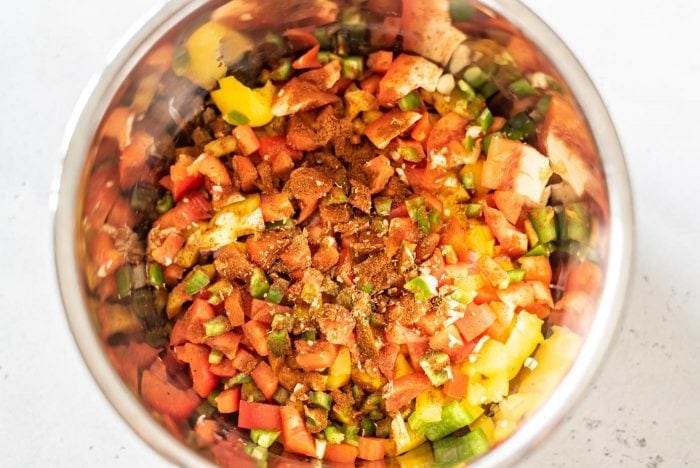 Bell peppers, onion, jalapeno and spices in an Instant Pot.