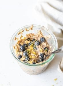 Overnight oats with blueberries in a jar.