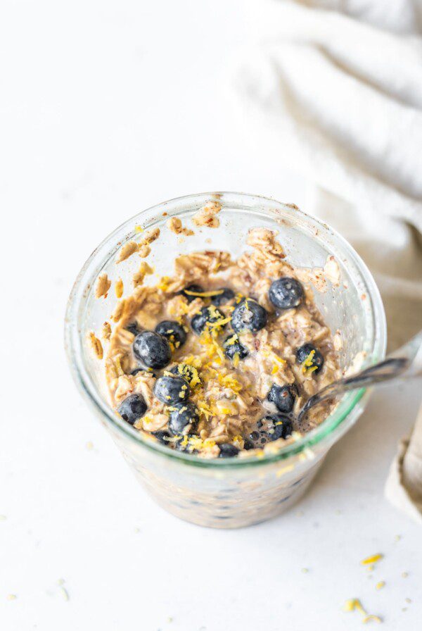 Overnight oats with blueberries in a jar.