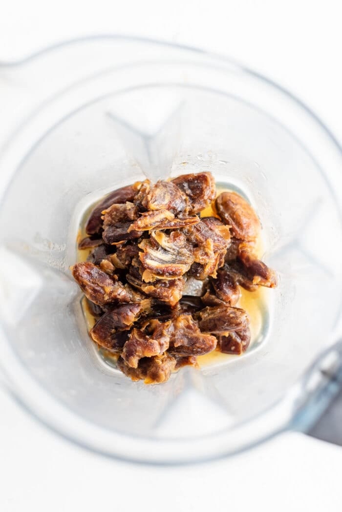 Pitted dates and water in a Vitamix container.