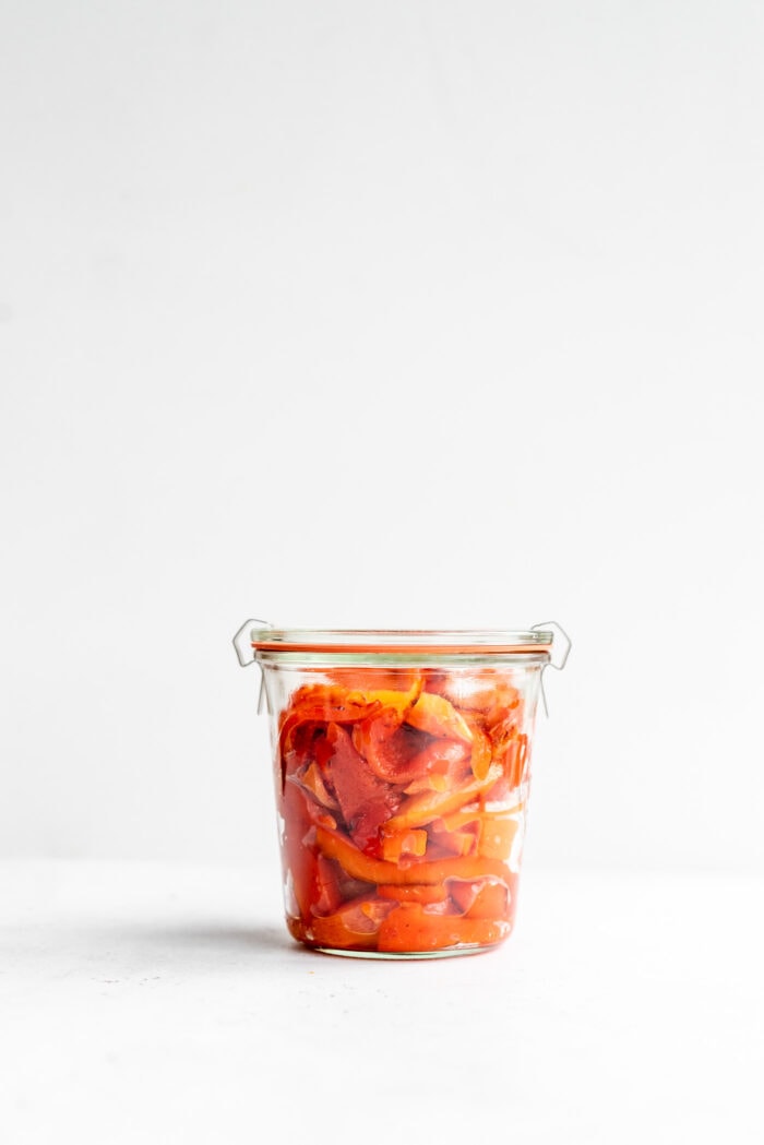 Sealed Weck jar packed with roasted red peppers.