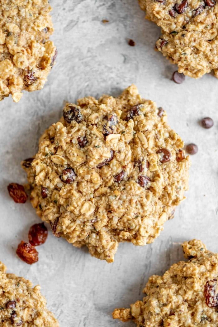 Close-up overhead image of a healthy oat cookie with chocolate chips and raisins.