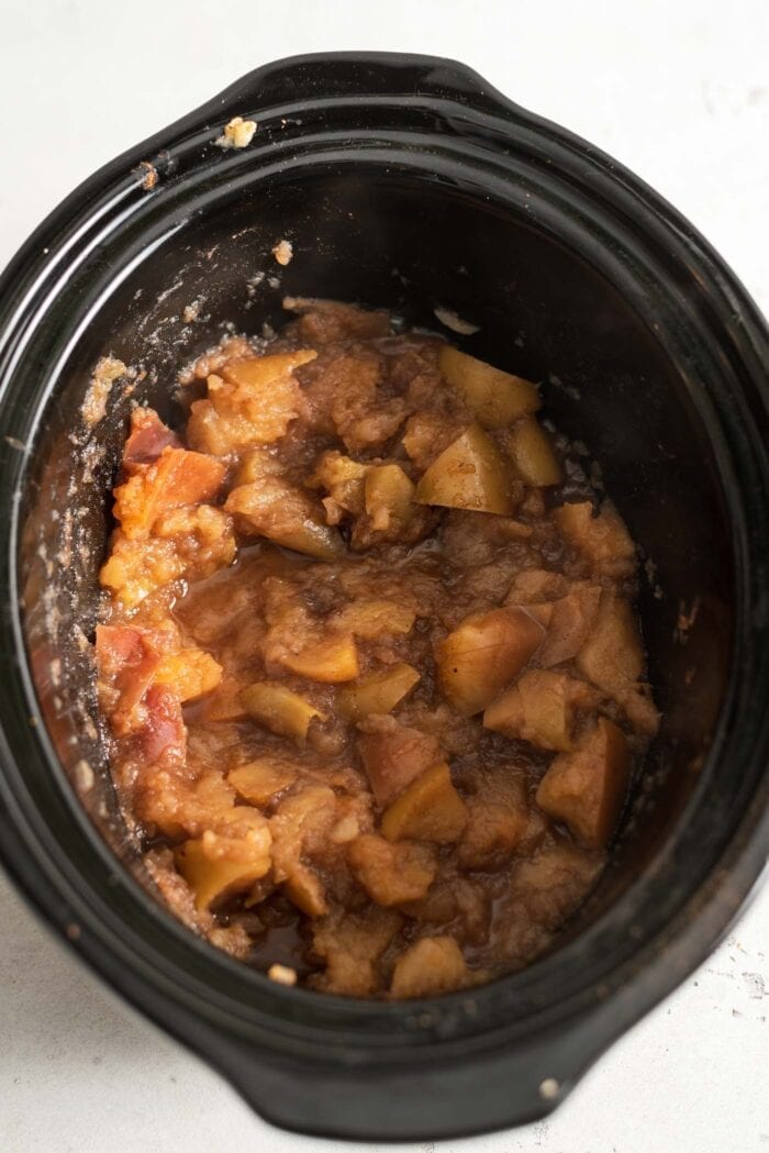 Cooked apples in a slow cooker.