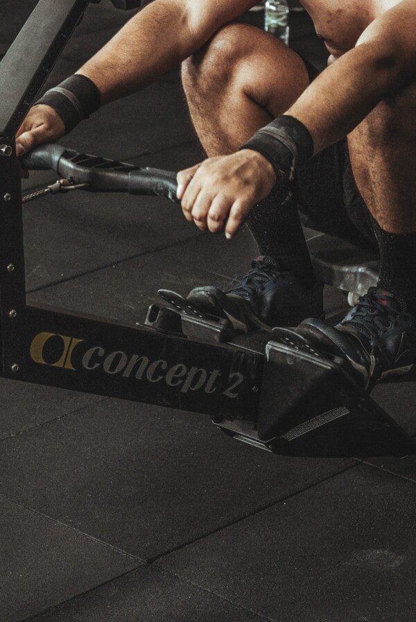 Man on a Concept 2 rowing machine.