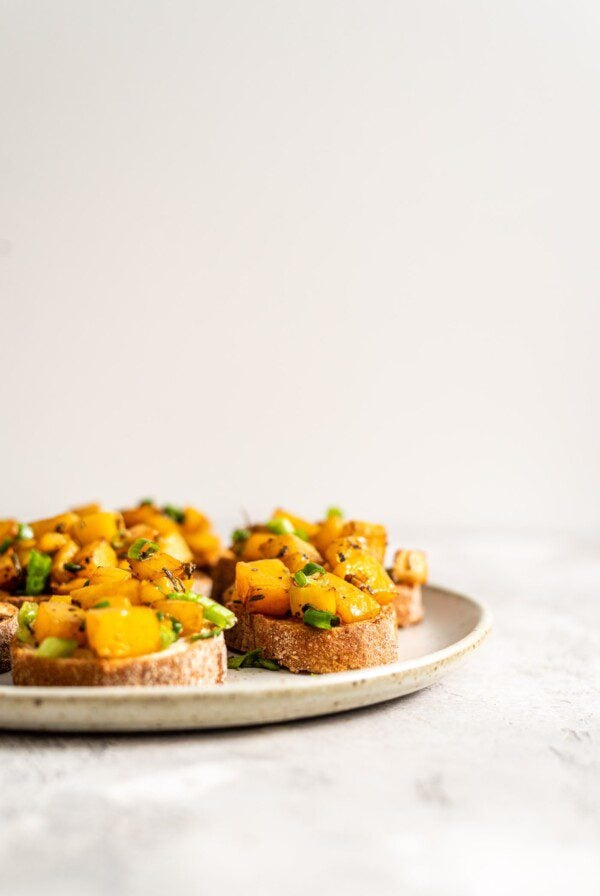 A plate of butternut squash bruschetta.