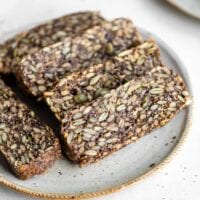 Slices of hearty seed bread on a plate.