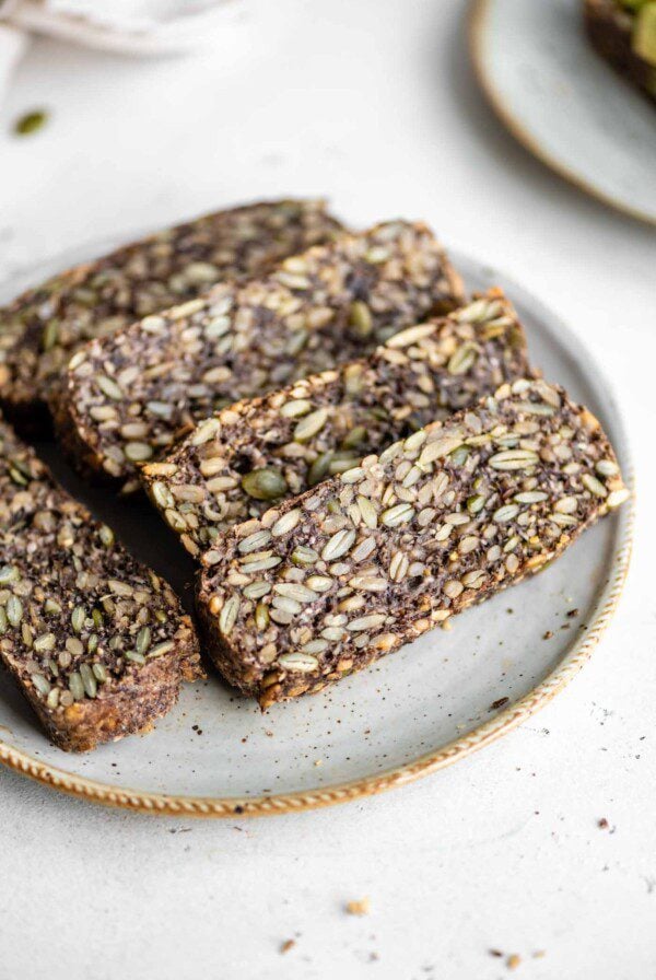 Slices of hearty seed bread on a plate.