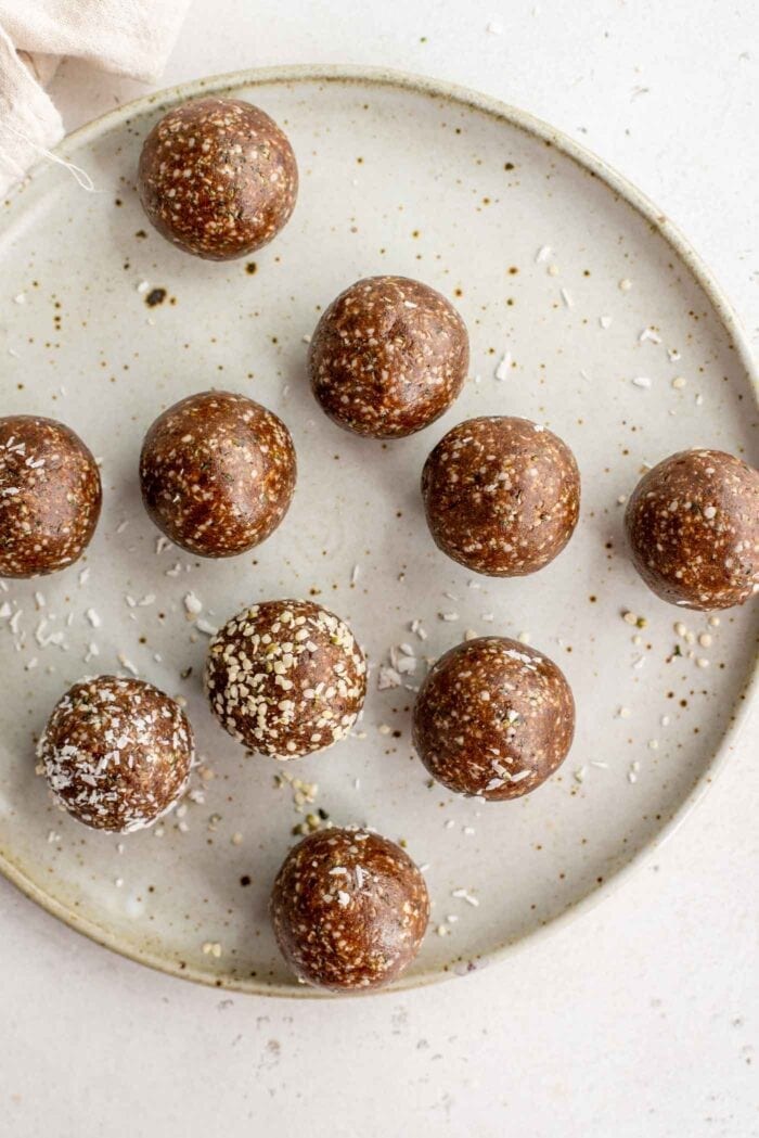 Raw energy balls on a plate.
