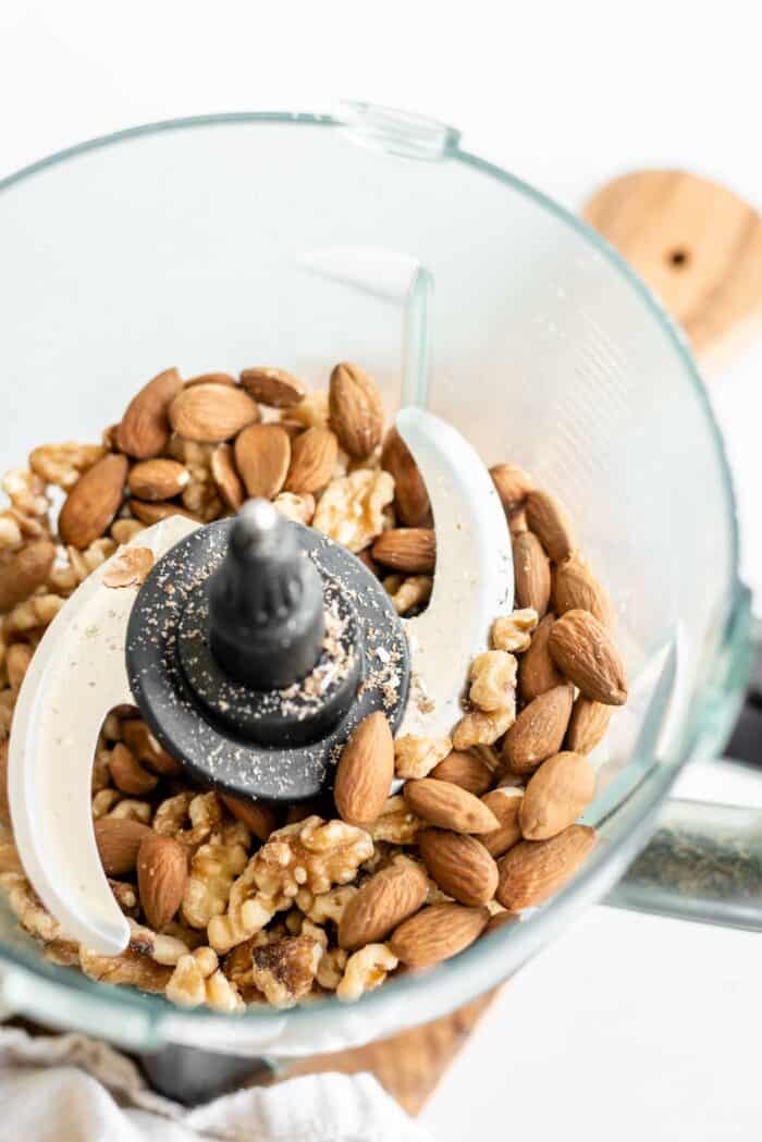 Walnuts and almonds in a food processor.