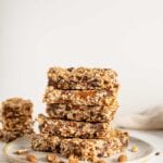A stack of homemade granola bars on a plate.