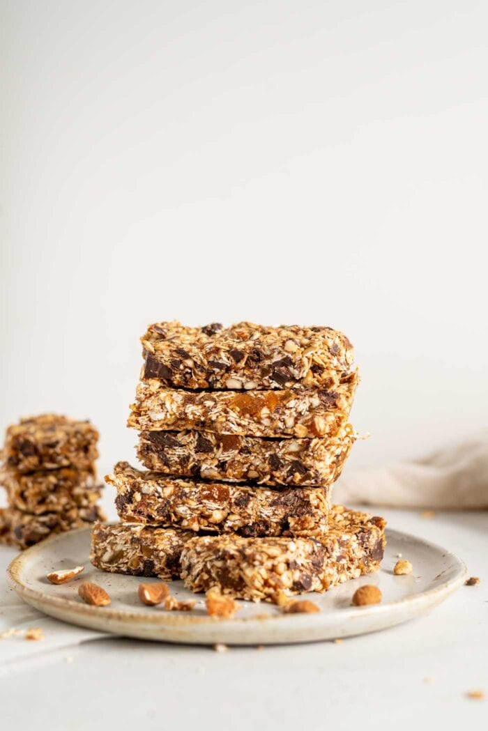A stack of homemade granola bars on a plate.