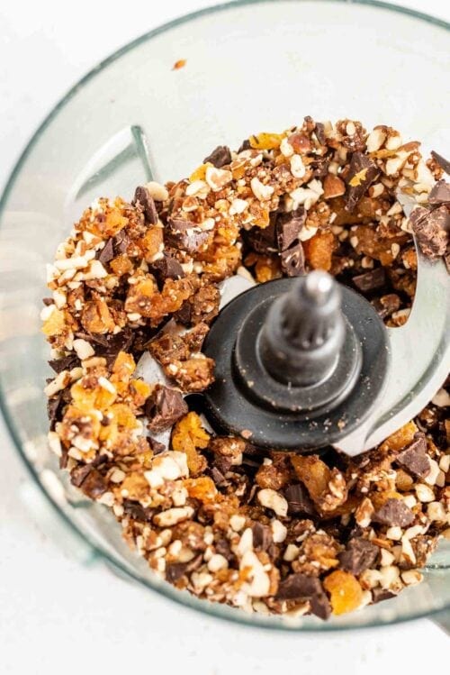 Blended dates, apricots, almonds and dark chocolate in a food processor.