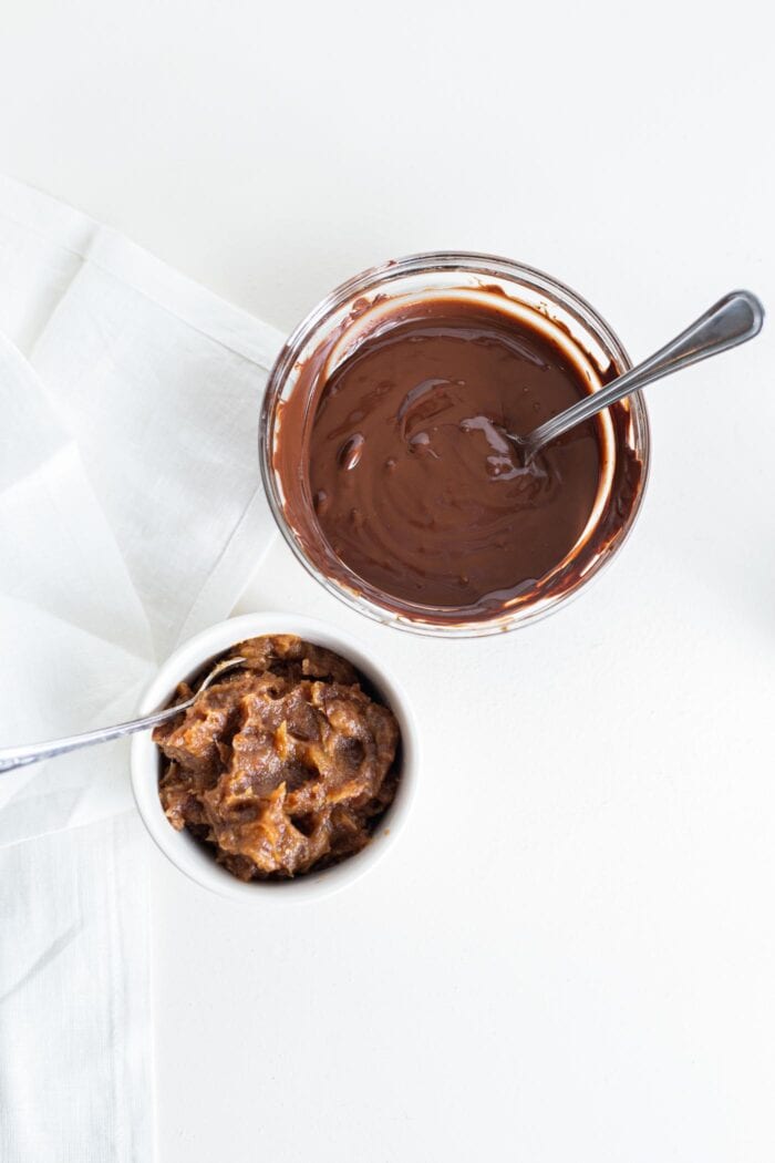 Melted chocolate and date paste in small bowls.